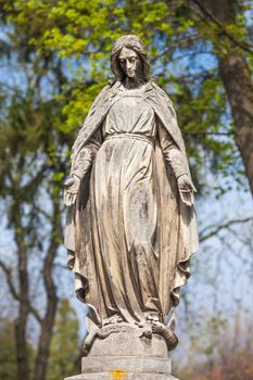 Old statue on grave in the Lychakivskyj cemetery of Lviv, Ukraine.