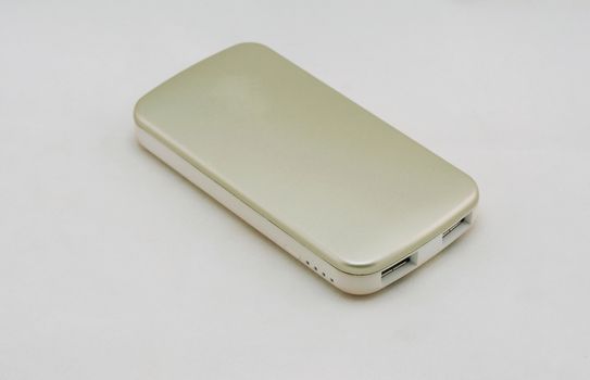 Gold optional external battery for an energy boost placed on a white background.                               