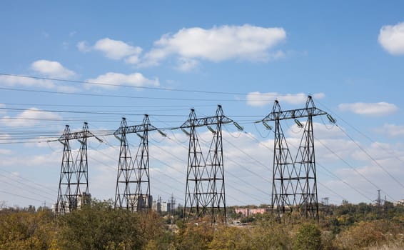 Power transmission tower against the blue sky background.