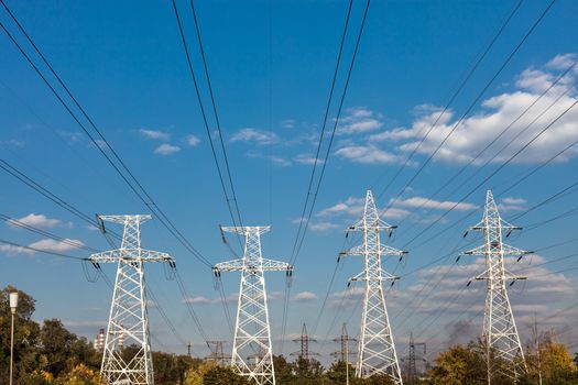 Power transmission tower against the blue sky background.