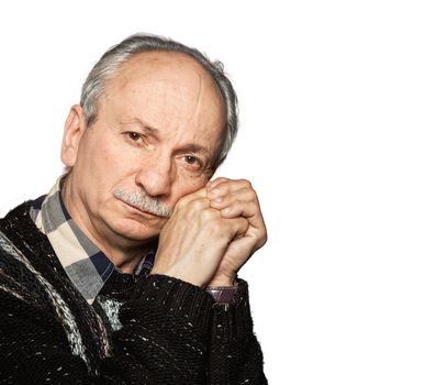 Handsome senior man with a skeptical expression isolated on white