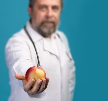 Healthy lifestyles concept. Doctor giving apple for healthy eating and lifestyle or good diet
