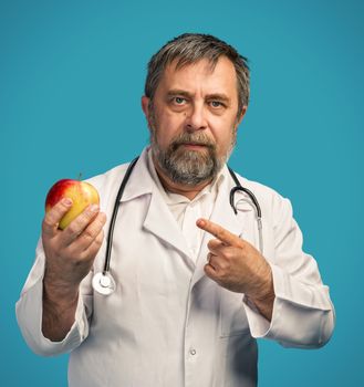 Healthy lifestyles concept. Doctor giving apple for healthy eating and lifestyle or good diet