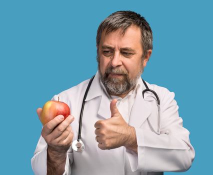 Healthy lifestyles concept. Doctor giving apple for healthy eating and lifestyle or good diet