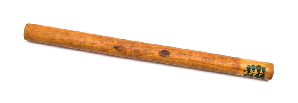 Antique wooden rolling pin on a white background