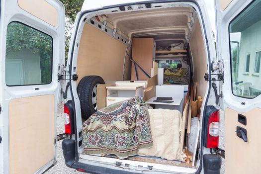 Interior of A Moving Van On Street With Household Furnishings.
