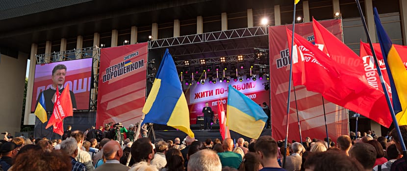 UZHGOROD, UKRAINE - MAY 1, 2014: Most rating Ukrainian presidential candidate Petro Poroshenko speaks at election meeting in Uzhgorod. On the poster: Live in new ways. Petro Poroshenko