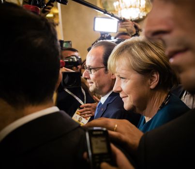 MILAN, ITALY - Oct 17, 2014: German Chancellor Angela Merkel and French President Francois Hollande after the meeting on the ASEM summit of European and Asian leaders in Milan