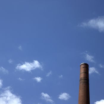 Brown brick chimney and blue sky
