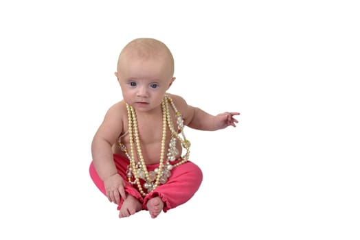 6 month baby girl wearing several necklaces isolated on white