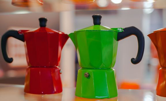 View of many colorful Moka, Italian coffee maker