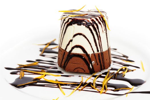 Chocolate and cream mousse on white plate