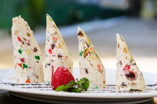 Italian dessert semifreddo with succades and strawberry