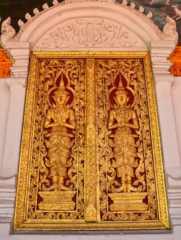 Church door in Wat Phra That Hariphunchai , Lamphun Province, Thailand