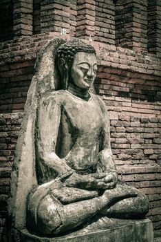 LAMPHUN,THAILAND-Se ptember 27:Old buddha in Wat Phra That Hariphunchai.Constr ucted around the 13th century in Lamphun Thailand - September 27, 2014