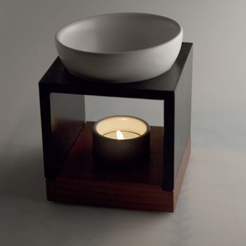 Scent diffuser over gray background, square image