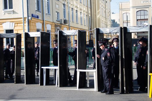 Moscow, Russia - September 21, 2014. Frame metal detectors police Peace March in Moscow against war with Ukraine