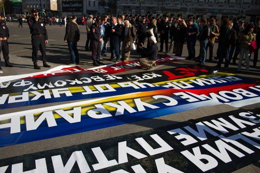 Moscow, Russia - September 21, 2014. Police chief Viktor Biryukov checks posters opposition peace March