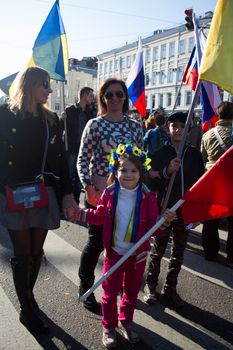 Moscow, Russia - September 21, 2014. The little girl in the Ukrainian wreath. Peace March in Moscow against war with Ukraine