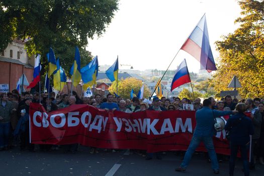 Moscow, Russia - September 21, 2014. A poster in support of political prisoners on the March for peace Peace March against war with Ukraine