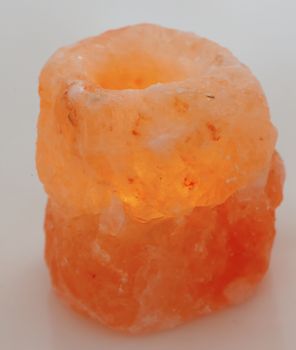 Pink stone with a lit candle inside