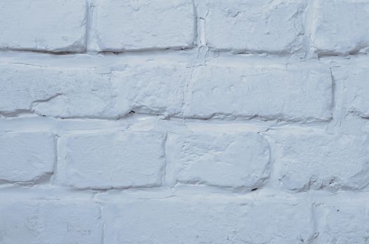 Background of White Blue Brick Wall Painted with White Mortar closeup