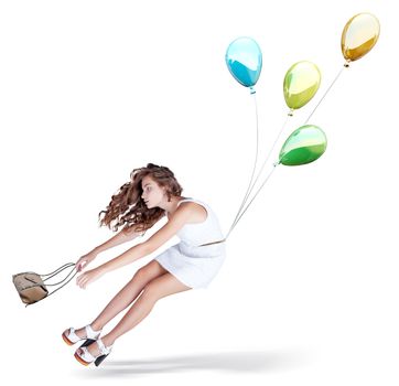 Balloons fly with young beautiful girl. Isolated Creative concept