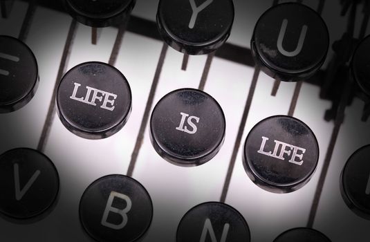 Typewriter with special buttons, life is life
