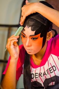 BANGKOK - OCTOBER 22: Unidentified Chinese opera actress applies makeup backstage at Theaters of Thailand's ethnic Chinese in Chinatown on October 27, 2014 in Bangkok, Thailand.