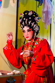 BANGKOK - OCTOBER 22: Unidentified Chinese opera actress applies makeup backstage at Theaters of Thailand's ethnic Chinese in Chinatown on October 27, 2014 in Bangkok, Thailand.