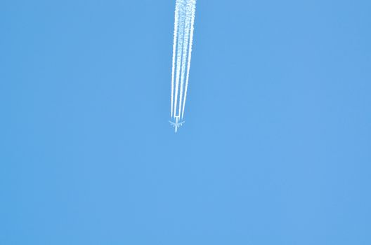 Contrails: clouds of ice crystals above about 8 km away. 
Formed mostly of hot water vapor-containing engine exhaust 
Image well suited for brochures, articles in magazines, books, advertisements, flyers, CD covers or backgrounds
