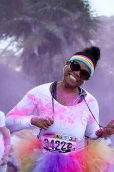 Ventura, CA - OCTOBER 18 : Participants coming through the pink color station at The Color Run 2014 in Ventura. OCTOBER 18, 2014 in Ventura, CA.