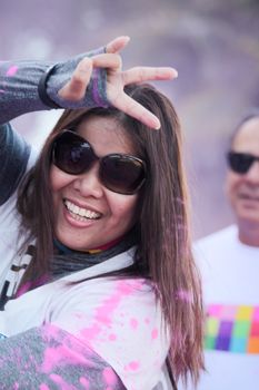 Ventura, CA - OCTOBER 18 : Participants coming through the pink color station at The Color Run 2014 in Ventura. OCTOBER 18, 2014 in Ventura, CA.