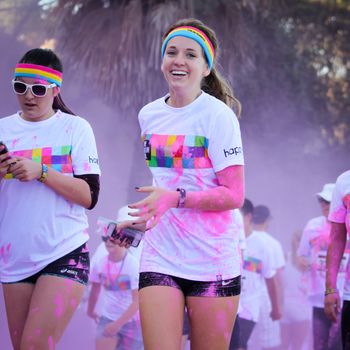 Ventura, CA - OCTOBER 18 : Participants coming through the pink color station at The Color Run 2014 in Ventura. OCTOBER 18, 2014 in Ventura, CA.