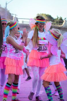 Ventura, CA - OCTOBER 18 : Participants coming through the pink color station at The Color Run 2014 in Ventura. OCTOBER 18, 2014 in Ventura, CA.