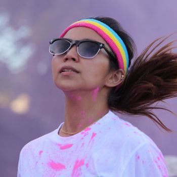 Ventura, CA - OCTOBER 18 : Participants coming through the pink color station at The Color Run 2014 in Ventura. OCTOBER 18, 2014 in Ventura, CA.