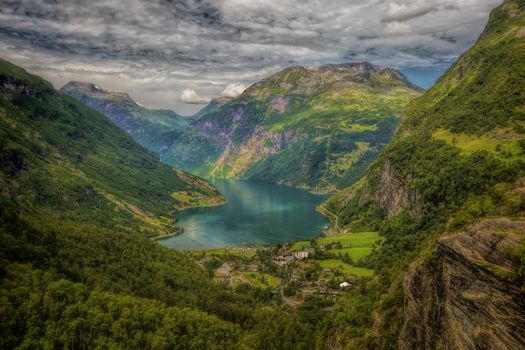 The Geiranger fjord in Norway, surrounded by high mountains