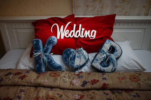 word white wedding on the beautiful red pillow