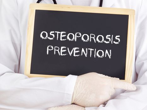 Doctor shows information: osteoporosis prevention