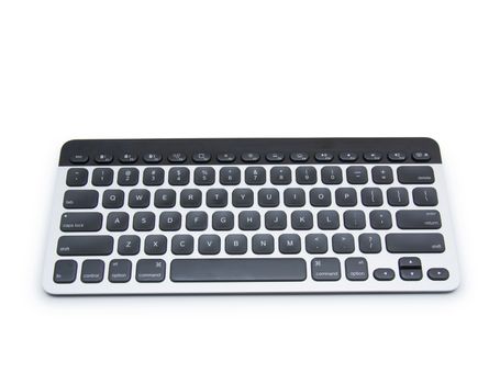 Modern aluminum computer keyboard isolated on white background