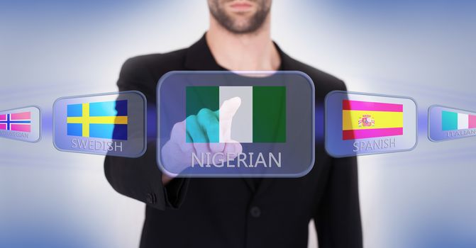 Hand pushing on a touch screen interface, choosing language or country, Nigeria