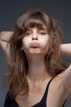 Portrait of a Young Woman with Brown Hair Making a Face