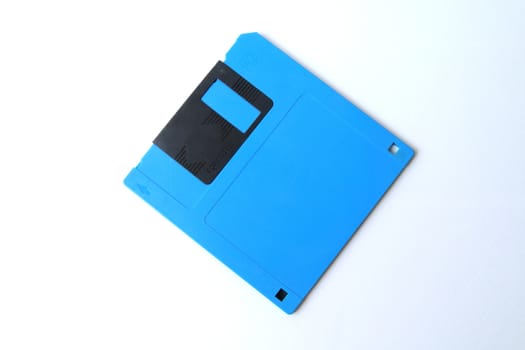 Blue floppy disk on white background.
