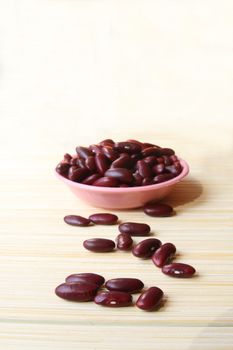 Some kidney bean are in the small bowl.