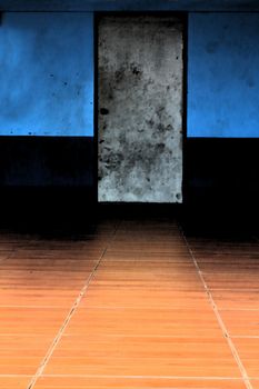 The image of an old door and ceramic floor.