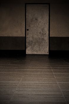 The image of an old door and ceramic floor.