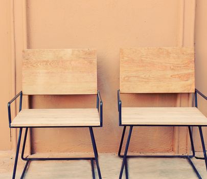 Outdoor wooden chairs with retro filter effect 