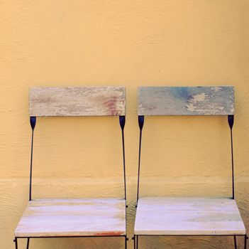 Outdoor wooden chairs with retro filter effect 