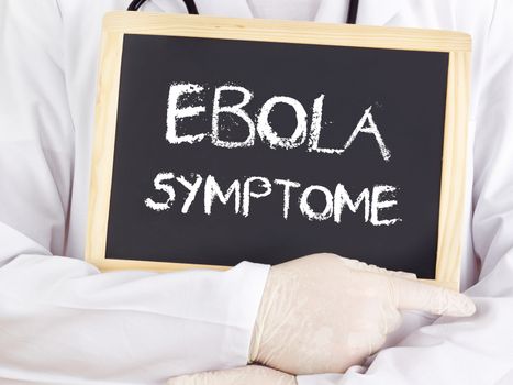 Doctor shows information: Ebola symptoms in german