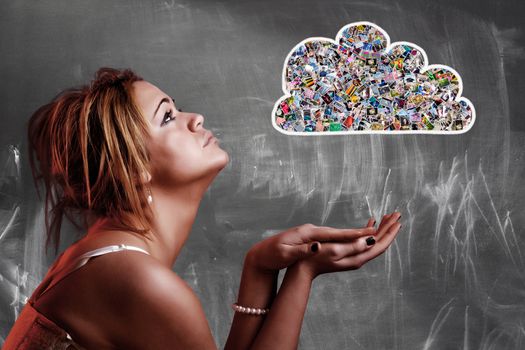 Cloud computing concept. Girl looking a cloud composed with many photos